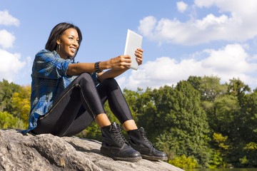 Young woman using digital tablet