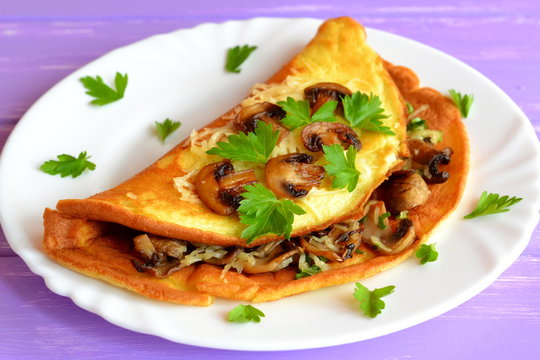 Omelette stuffed with mushrooms and cheese. Delicious omelet recipe. Simple egg recipe. Vegetarian recipe