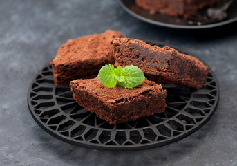 brownies chocolate cake, horizontal. Black stone background