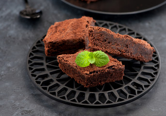 brownie chocolate cake, horizontal. Black stone background