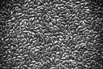 monochrome  flax seeds grain, healthy food background