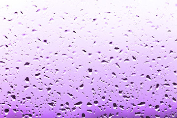 color bright raindrops on glass, rain weather background