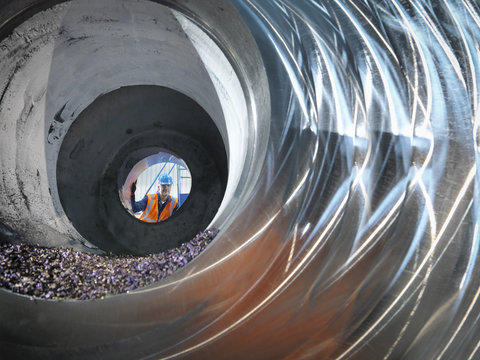 Steelworker Inspecting Cast Steel In Engineering Factory