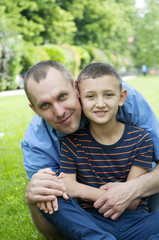 happy father and son in the park