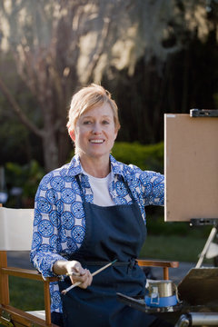Female plein-air painter in Albin Polasek Museum and Sculpture Garden, Winter Park, Florida, USA