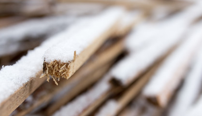 firewood in the snow in the winter