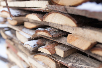 firewood in the snow in the winter