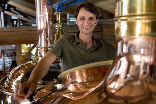Male brewer working in brewhouse