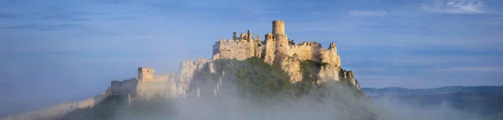 Papier Peint photo Château panorama with foggy old castle on the hill in the morning
