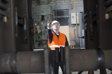 Dock worker giving instruction at port