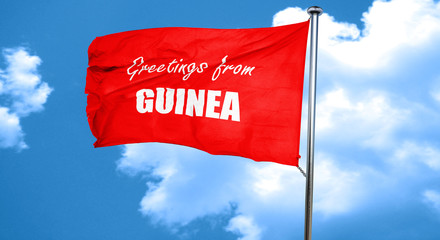 Greetings from guinea, 3D rendering, a red waving flag