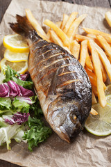 Grilled fish with salad and frensh fries