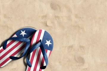 Thongs with flag of Liberia, on beach sand