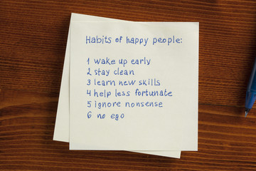 Habit of happy people written on note