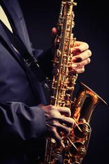 Fototapeta premium African American jazz musician playing the saxophone, closeup