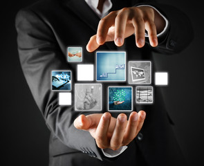 Man with preview digital business photos on virtual screen, concept of modern technology