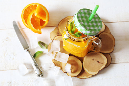 Orange juice and ice cubes
