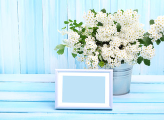 Photo frame flower garden wooden background gentle blue tone
