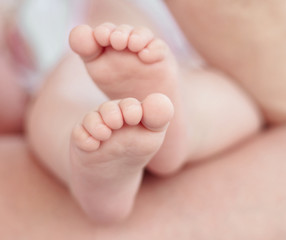 Fototapeta na wymiar Picture of little baby feets.