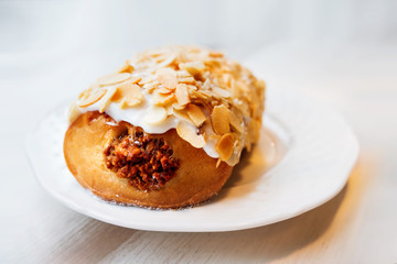 Tasty cake with marzipan icing and almond nuts.