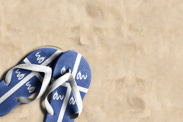 Thongs with flag of Martinique, on beach sand