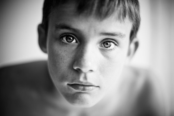 Black and white portrait of serious child close up