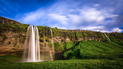 Seljalandsfoss - Iceland. Another of the famous waterfalls of Iceland. This waterfall of the river Seljalands? drops 60 metres (200 ft) over the cliffs of the former coastline