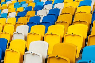 Naklejka premium Empty plastic seats in a footbal or soccer stadium. 2016 sport background