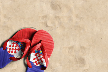 Thongs with flag of Croatia, on beach sand
