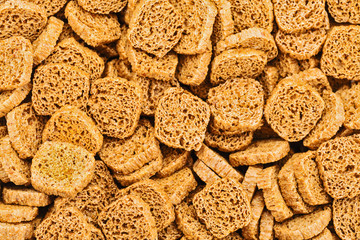 Many small dried rusks  as texture background.