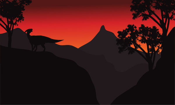 At sunset silhouette parasaurolophus in cliff