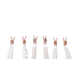 group of hands showing victory sign
