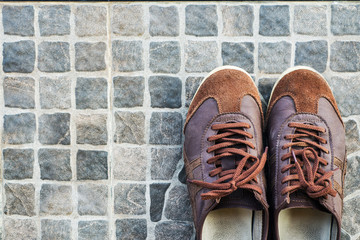 Leather shoes on tile floor