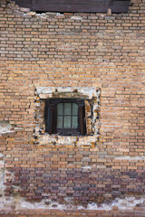 brick wall with small window