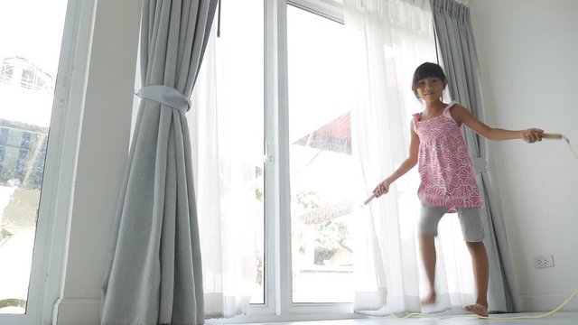 Asian Girl Jumping Rope At Home