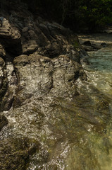 Stones on beach and sea water.