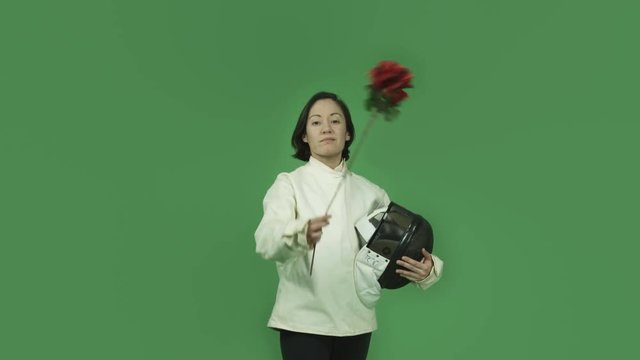 caucasian fencing with sword girl isolated on green screen in love romance rose