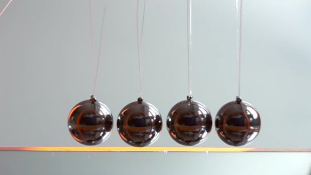 Newtons Cradle in slow motion science concept