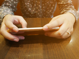 Close up of woman using mobile smart phone