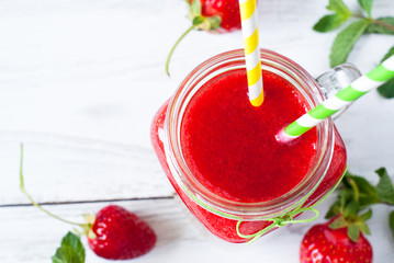 Strawberry smoothie in a mason jar