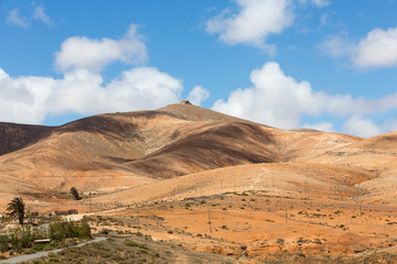 Naklejka na ściany i meble Landscape of fields and mountains near Antigua village, Fuerteventura, Canary Islands, Spain