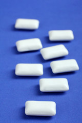 white chewing gum in the form of pads on a blue background