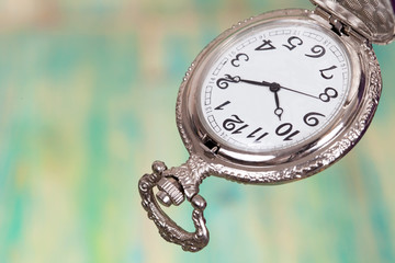 vintage pocket watch with old wood background