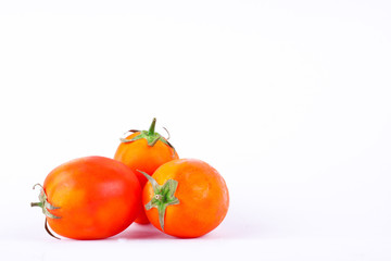 fresh Red tomatos is high in vitamin C vegetables fruit food on the white background isolated
