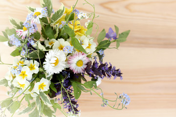 spring floral extravaganza/background with a bunch of different wildflowers top view 