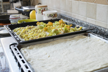 home made pizza dough in baking tray
