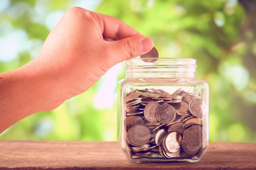 save money for investment concept money in the glass with filter