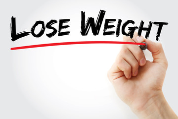Hand writing Lose Weight with marker, health concept background
