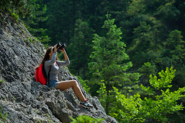 young beautiful girl climbing the rock