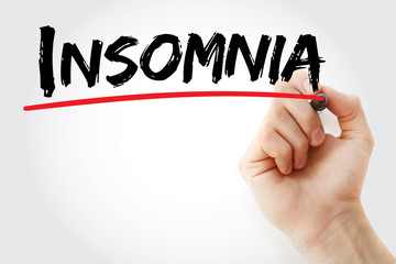 Hand writing Insomnia with marker, health concept background